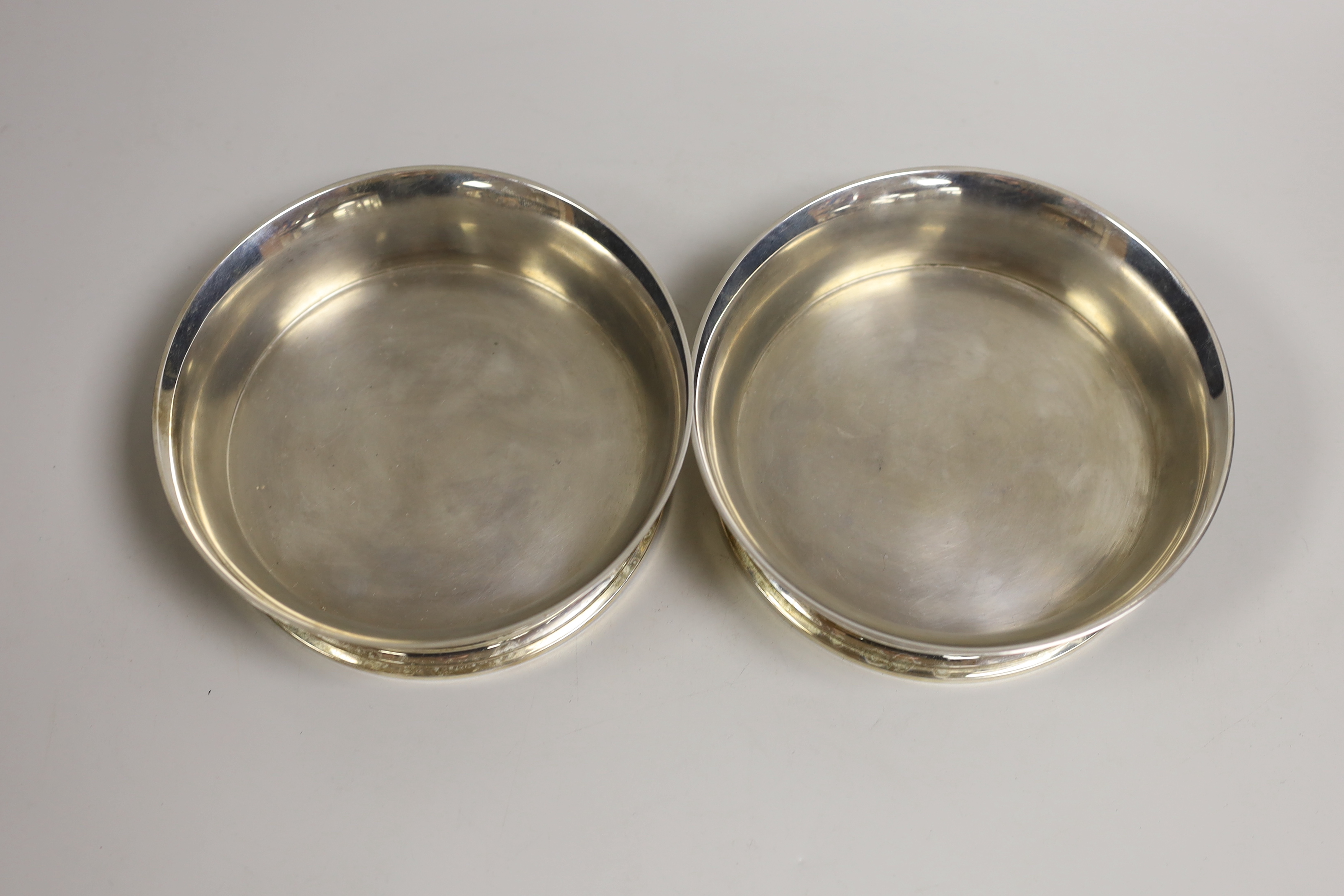 A pair of Elizabeth II silver wine coaster, William Comyns & Sons Ltd, London, 1974, diameter 14.9cm, 21.5oz.